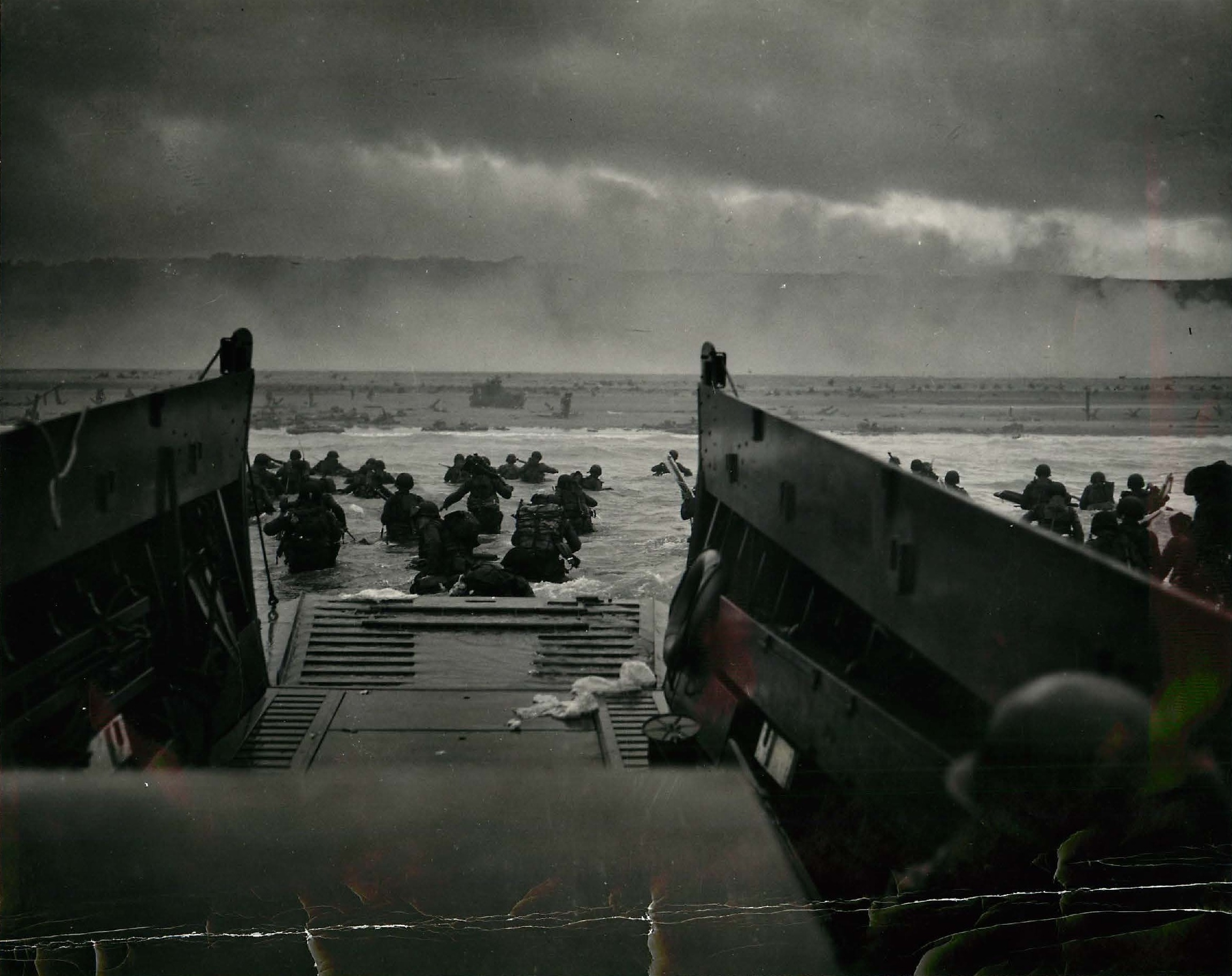 United States troops wading ashore at Omaha Beach on D-Day